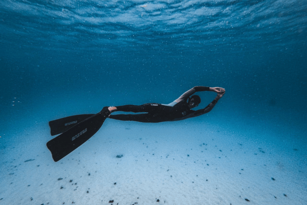 Person wearing protective diving suit