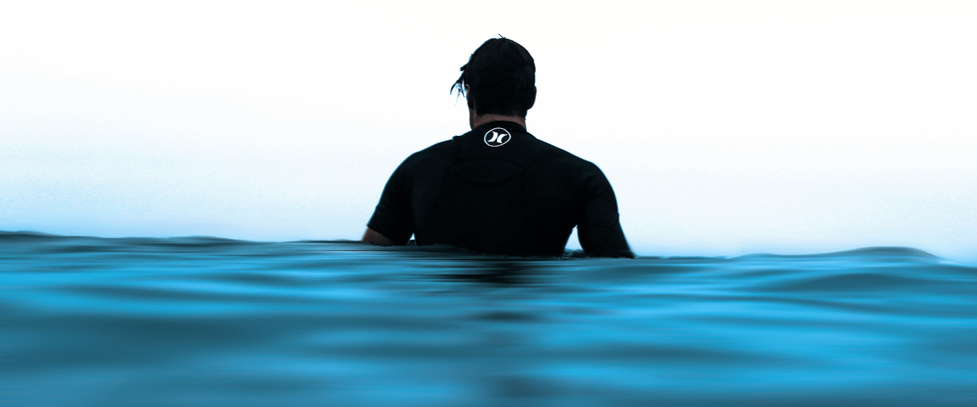 person with stinger suit in the ocean